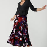 Size 10 woman wears the Berit Maxi skirt in the Fitzroy Print. Styled back with black pumps. Made in Australia for women size 8 - 24.