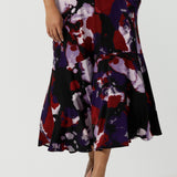 Close up of a Size 10 woman wears the Berit Maxi skirt in the Fitzroy Print. Styled back with pink pumps and the Amethyst Ziggy Top. Made in Australia for women size 8 - 24.