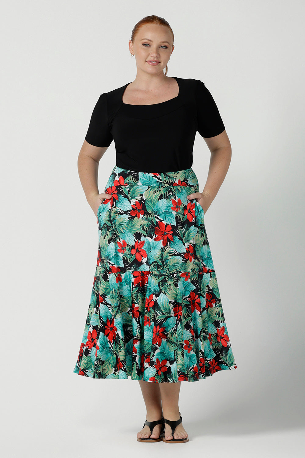 Size 12 woman wears Maxi Skirt in Havana print. Styled back with a black Berni Top. The Berit Maxi skirt features a tier, a waistband and side pockets. Perfect for a weekend away or holiday capsule wardrobe. Made in Australia for women size 8 - 24.