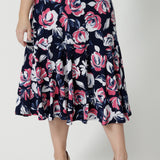 Close up front on image of printed wide midi length skirt, made of easy to care dry touch jersey. Floral pant shows roses in pink, white and navy. Easy to care fabric is used to craft Australian made garments for woman in Australia and New Zealand. Leina & Fleur is size inclusive brand, proudly stocking sizes ranging from 8 to 24. 