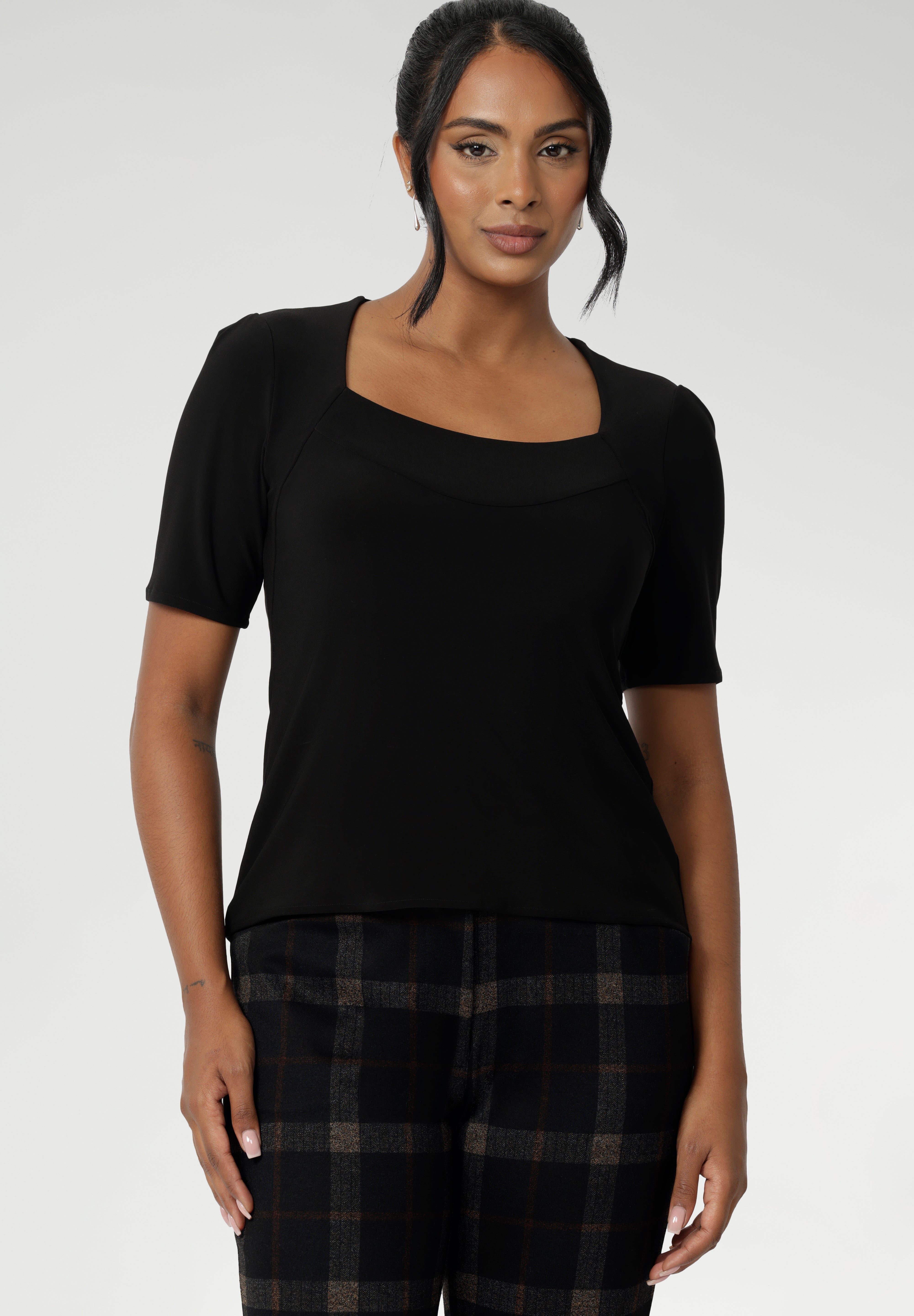 Slim fit top in classic black, this tailored jersey top wears well with workwear separates for an office look and also as a smart casual top. Shop tops online at Australian women's clothing brand, Leina & Fleur in sizes 8-24.