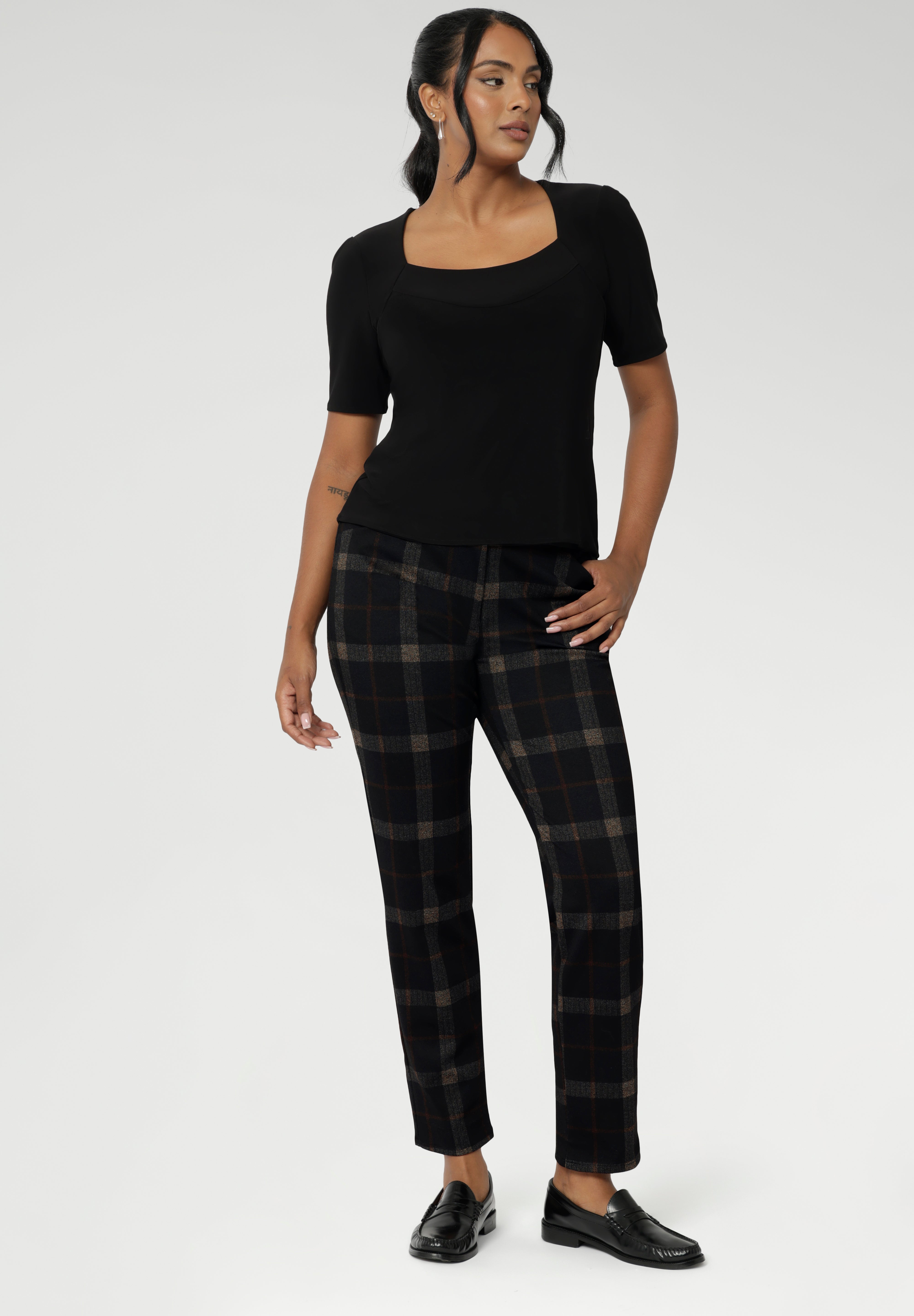 Featuring a flattering square neckline and a slim, tailored fit, this classic black top transitions effortlessly from office to off-duty. Perfectly paired with workwear separates for a polished professional look or styled with denim for elevated smart-casual dressing. 
