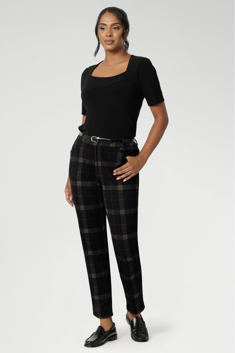 This short sleeve black jersey top is a must-have for women over 30 who appreciate timeless style and effortless versatility. Featuring a clean square neckline and a flattering slim fit, it’s the ideal foundation for a polished wardrobe. Easy to style under blazers and structured suiting.