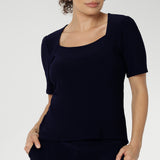 Australian made women's top has short fitted sleeves, a square neckline and and high-low. Ideal piece for weekend casual and travel capsule wardrobes. Available in sizes 8-24. 