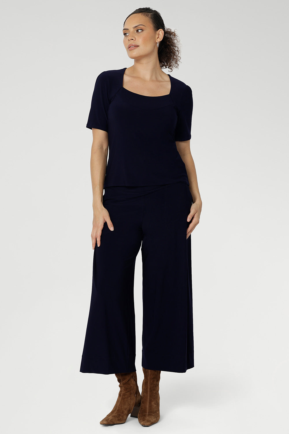 Navy short sleeved women's Top made from stretchy fabric is Australia. Available in sizes 8-24. Women's Navy Jersey Top is worn with navy culotte. 