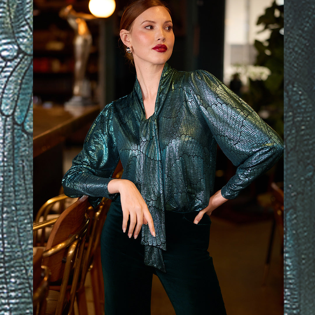 If you're looking for wedding guest dresses in Australia, why not shop alternatives like this elegant evening wear top with long sleeves. Worn with green velveteen cocktail pants, buy wedding guest outfits with a difference at Australian and New Zealand women's clothing brand, Leina & Fleur. 