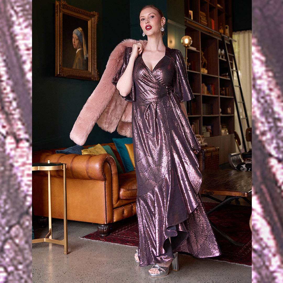 A great formal evening dress, this maxi dress in shimmer jersey fabric is perfect as a formal attire for wedding guests and mother of the bride dress. Available in sizes 8 to 24, this formal dress is good for plus size women's evening wear too. 