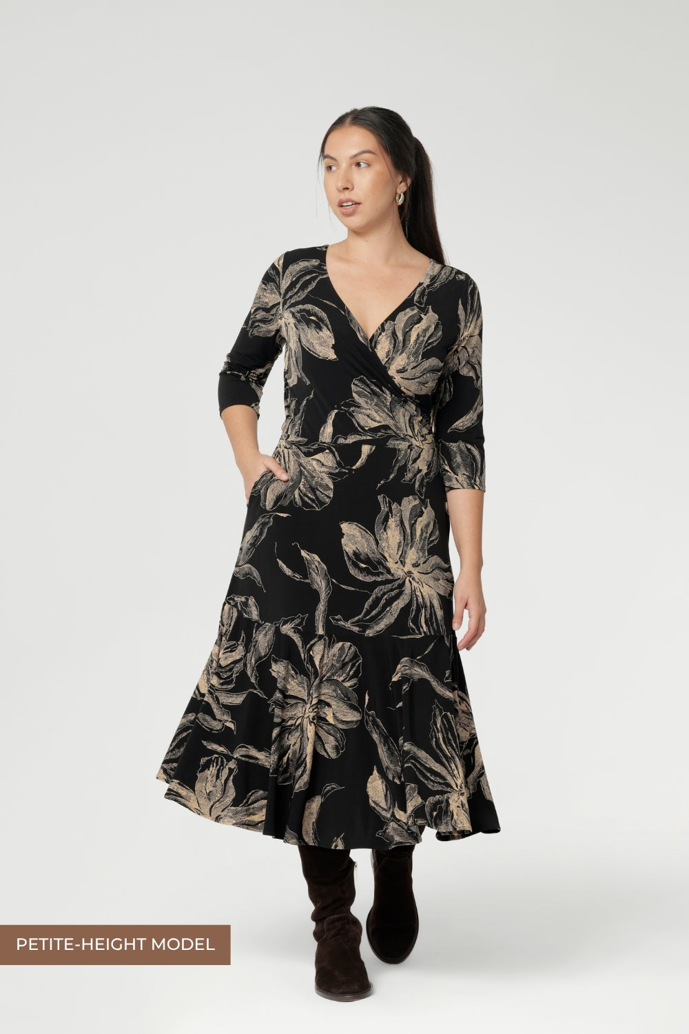 Details such as side pockets, skirt lining, and a double-layer boat neck bodice enhance both comfort and structure. Petite Height Model showcases the reversible dress in reverse.