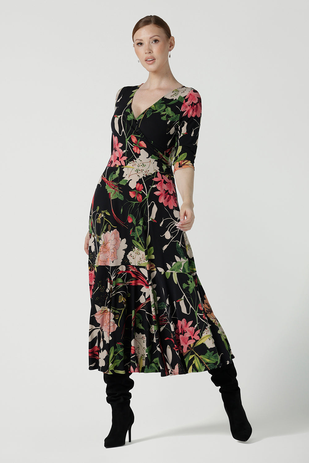 A size 10 woman wears the Bettina Reversible dress in Bloomsbury, a fixed wrap jersey dress that is maxi length and 3/4 sleeve. Made in Australia for women size 8 - 24. 