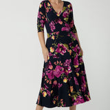 Size 10 woman wears the Bettina Reversible dress in Celeste. Fixed wrap style with pockets and v-neckline. Wear it multiple ways and reversible. Made in Australia for women size 8 - 24.