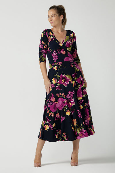 Size 10 woman wears the Bettina Reversible dress in Celeste. Fixed wrap style with pockets and v-neckline. Wear it multiple ways and reversible. Made in Australia for women size 8 - 24.