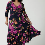 Size 18 woman wears the Bettina Reversible dress in Celeste. Fixed wrap style with pockets and v-neckline. Wear it multiple ways and reversible. Made in Australia for women size 8 - 24.