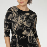 The fully reversible design offers two sophisticated neckline options: a fixed wrap V-neck on one side and a classic boat neckline with a subtle V-shaped back on the other, giving you two distinct looks in one. 