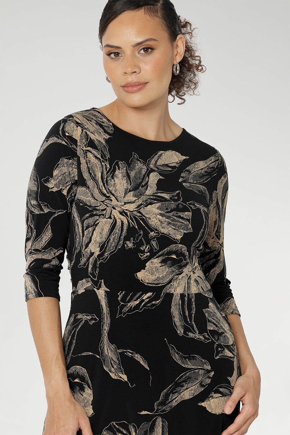 The fully reversible design offers two sophisticated neckline options: a fixed wrap V-neck on one side and a classic boat neckline with a subtle V-shaped back on the other, giving you two distinct looks in one. 