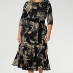 Crafted from our signature black dry-touch stretch jersey, this versatile midi dress is designed to deliver both style and function. Plus size model wears reversible dress with boat neckline and black belt to cinch at the waist.