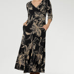 Crafted from our signature black dry-touch stretch jersey, this versatile midi dress is designed to deliver both style and function. Showcasing a deep, inky floral print in a rich coffee hue, it captures the moody elegance of the season.
