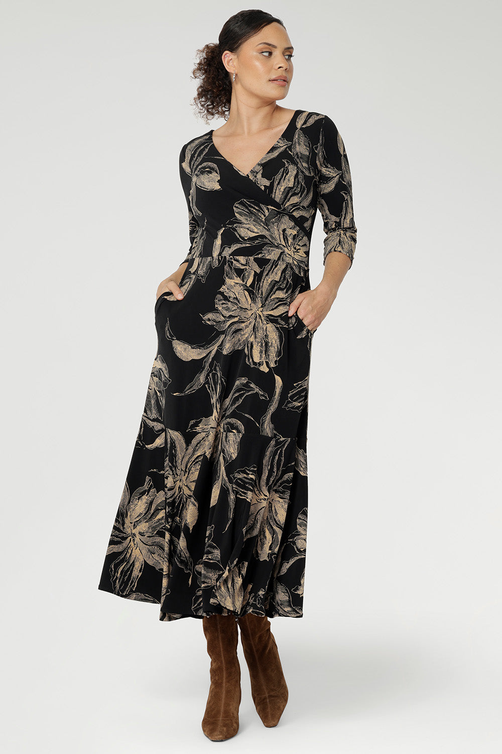 Crafted from our signature black dry-touch stretch jersey, this versatile midi dress is designed to deliver both style and function. Showcasing a deep, inky floral print in a rich coffee hue, it captures the moody elegance of the season.