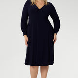 Featuring a sophisticated V-neckline with a twist-front bodice and cuffed long sleeves, it creates a flattering silhouette with elegant detail. Made in Australia from our signature dry-touch jersey fabric, it offers all-day comfort, stretch, and easy care. Available in sizes 8 to 24, this versatile piece is designed to flatter petite and plus-size women alike.