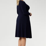 Available in sizes 8 to 24, this versatile piece is designed to flatter petite and plus-size women alike. Effortlessly layer it under a blazer or coat, or style it with stockings and boots during the cooler months for a chic, season-ready look.