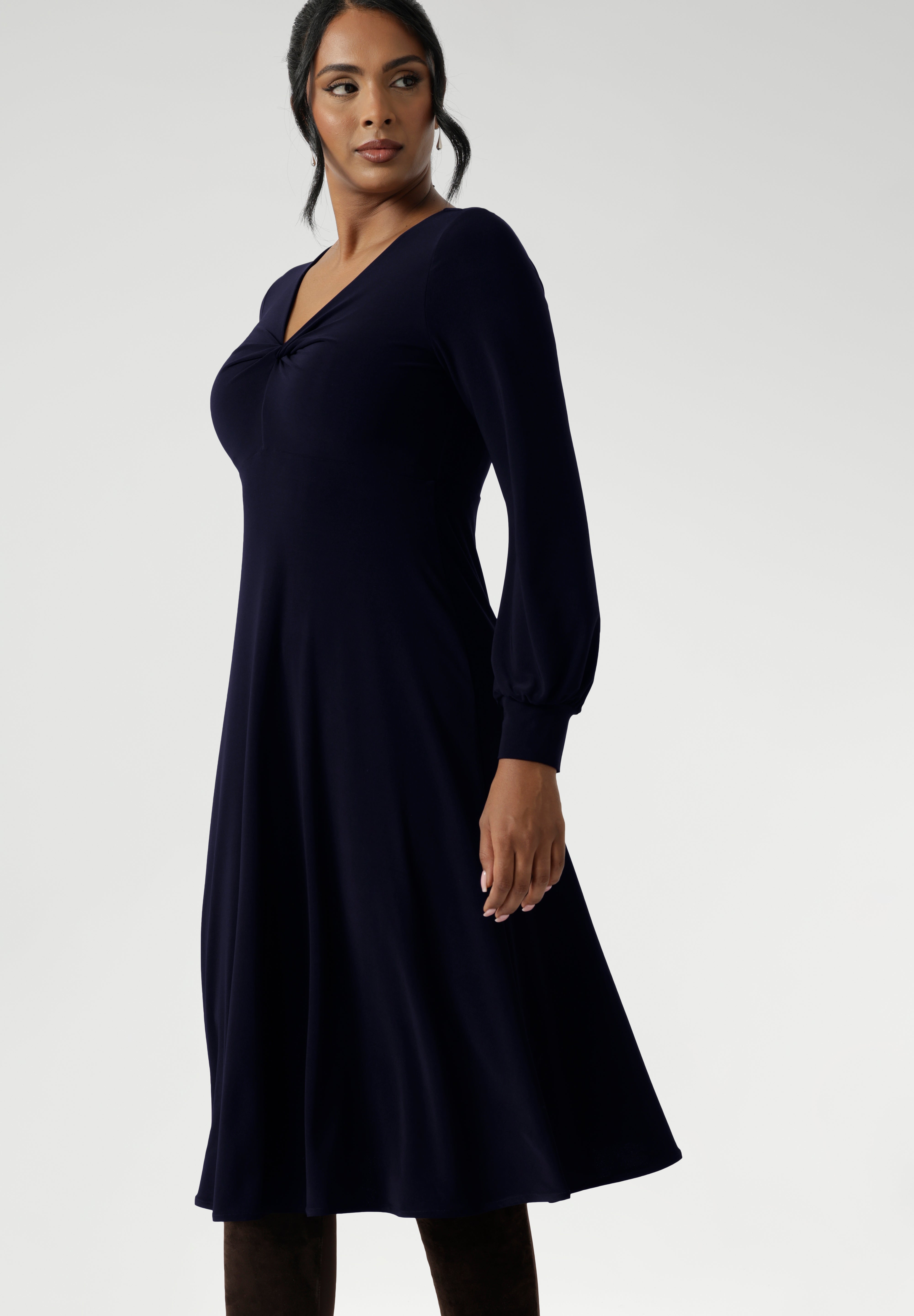 A dress that creates a flattering silhouette with elegant detail and is crafted pull on style. For effortless dressing The Bianca Dress in Navy is a long sleeve jersey dress perfect for work or classic event dressing. Made in Australia from our navy dry-touch jersey fabric. Available in size 8-24. 