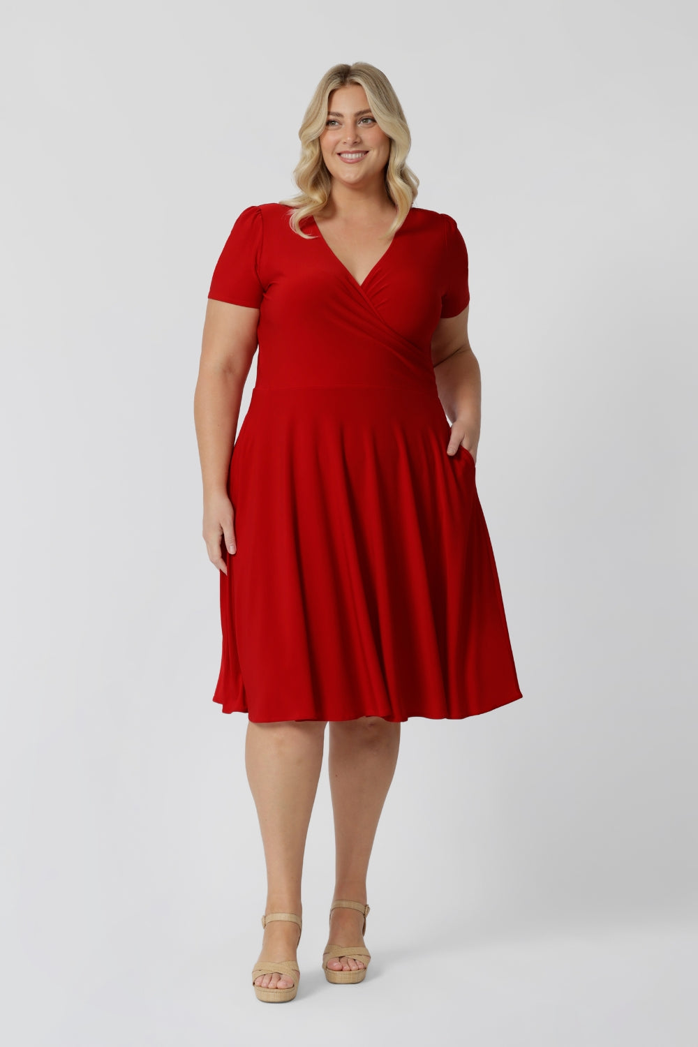 This elegant knee-length dress is crafted from a luxurious dry touch jersey fabric, perfect for the festive season. Featuring a vibrant red hue, it captures the essence of the season beautifully. Made in Australia, this dress is designed for women and is available in sizes 8 to 24, ensuring a flattering fit for all. Whether you're attending holiday gatherings or celebrating special moments, this dress combines style and comfort effortlessly.