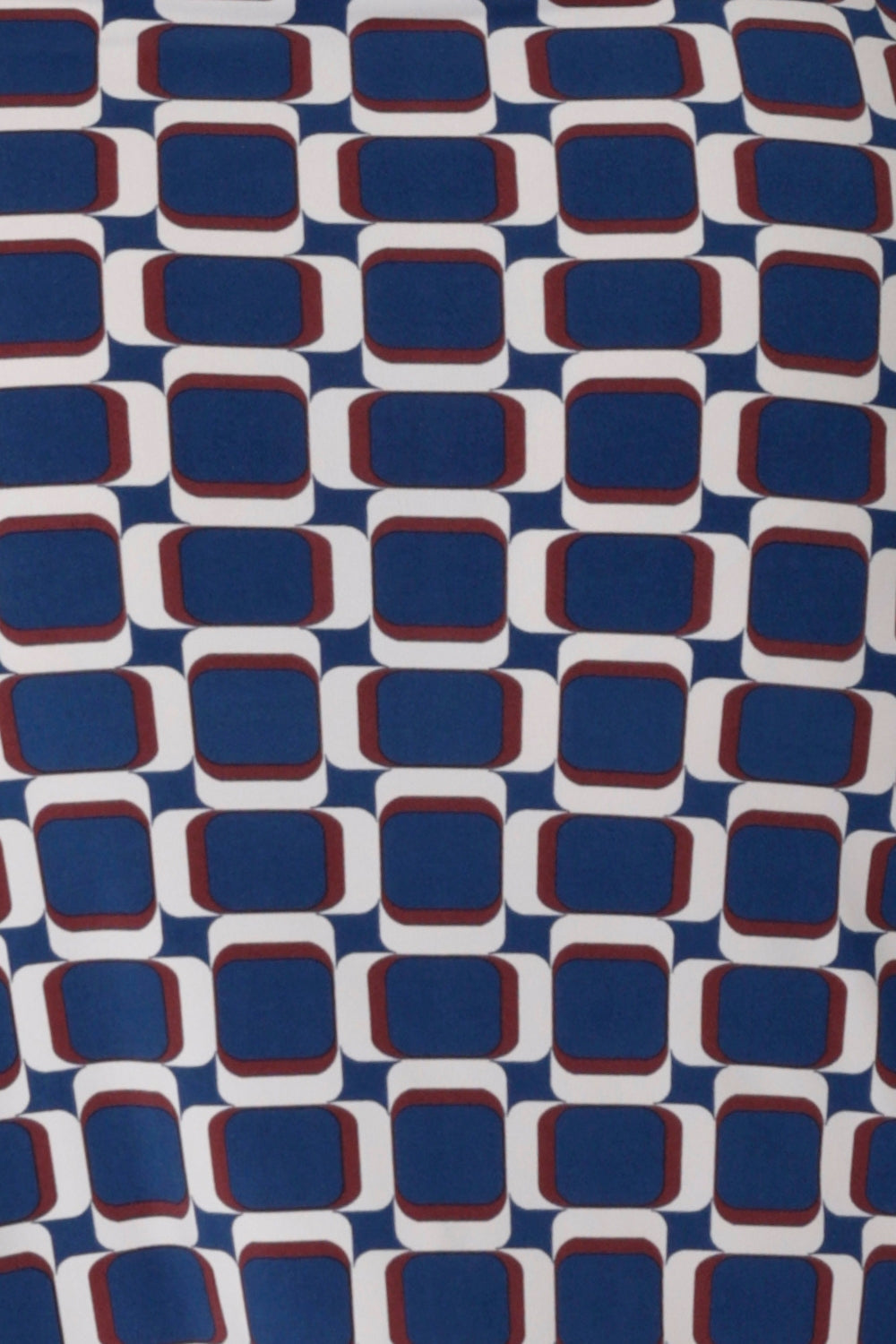 Image of fabric swatch used by Australian made woman's clothing brand Leina & Fleur, used to create a collection of woman's workwear tops in easy care printed and coloured dry touch jersey. The Blue Aperture print is on a dry touch jersey base that has a drier hand feel with print details in blue, vanilla and espresso. The fabric has a soft stretch and provides all day comfort. Available in sizes 8-24.