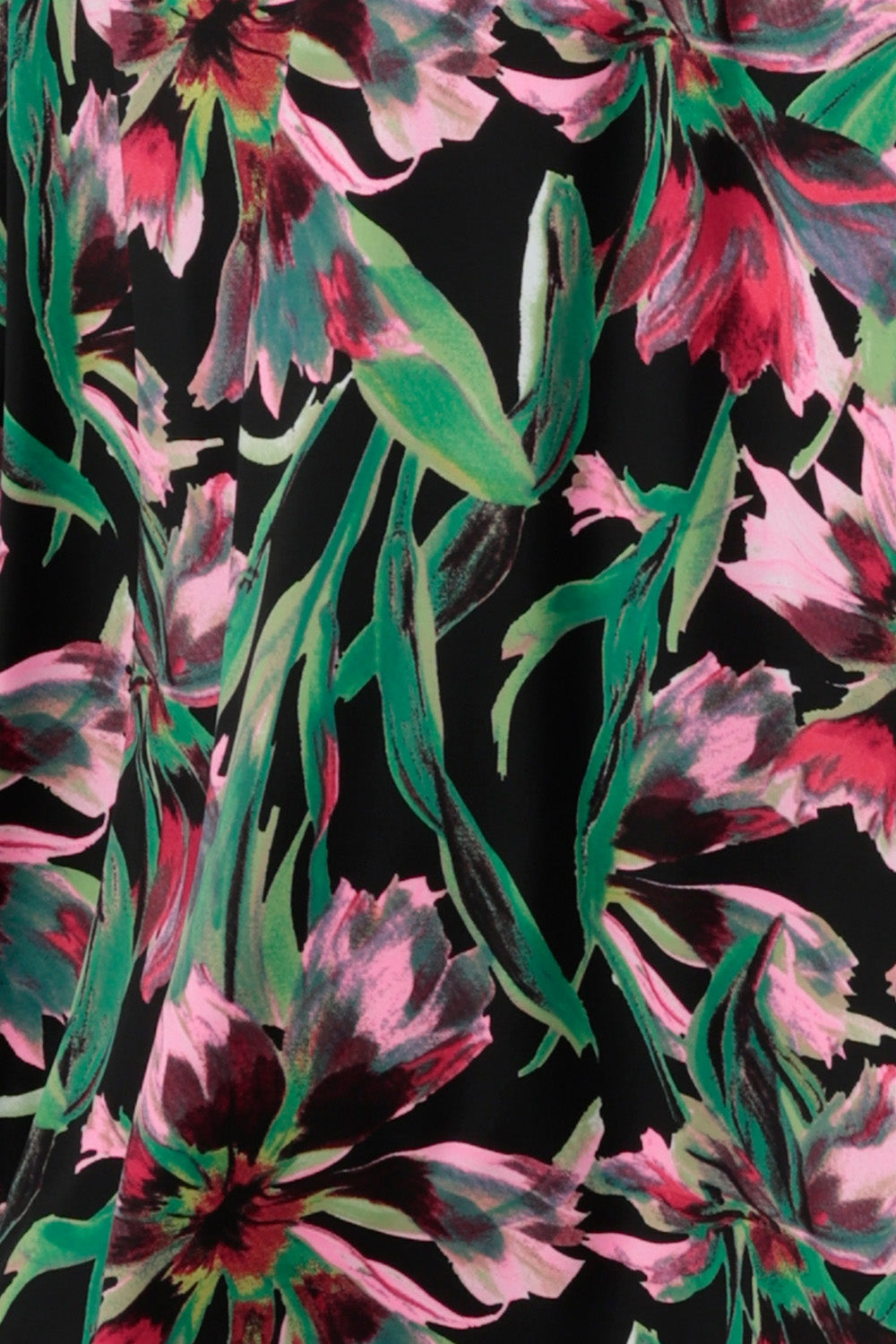 red and pink flowers and emerald green leaves make up this black-base, floral print jersey used by Australian-made women's clothes brand, Leina & Fleur.