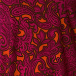 Bold Paisley print is on a soft-touch jersey base with paisley print details in fuchsia pink, orange and black. The fabric has a soft stretch and has been used to create an off duty collection featuring a cami and 2 travel pants.