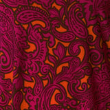 Bold Paisley print is on a soft-touch jersey base with paisley print details in fuchsia pink, orange and black. The fabric has a soft stretch and has been used to create an off duty collection featuring a cami and 2 travel pants.