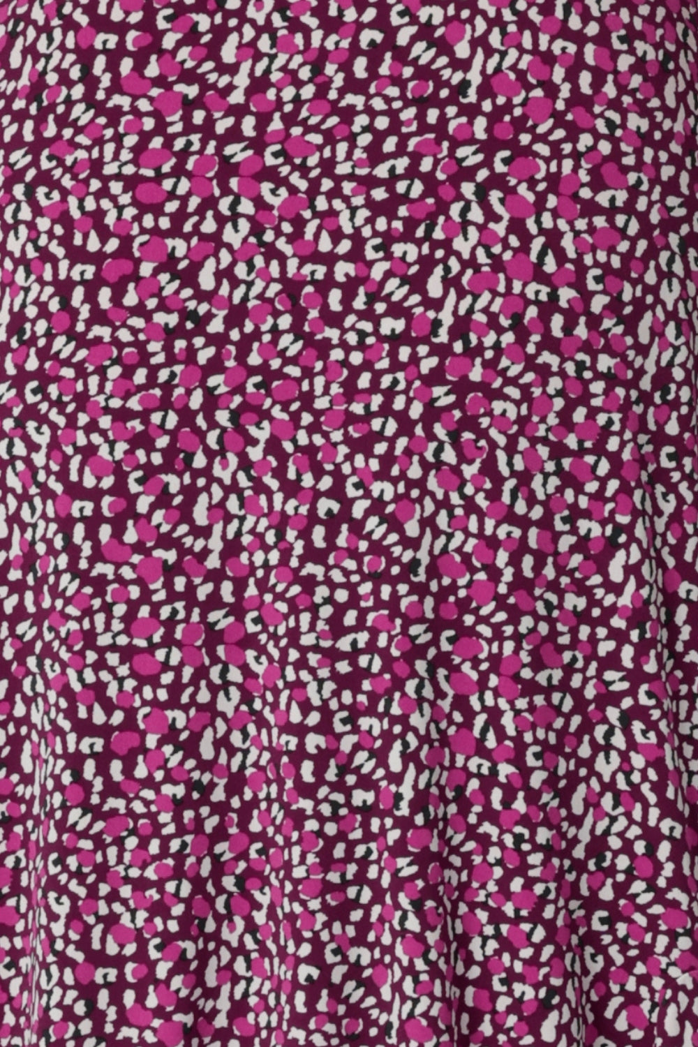 Fabric Swatch image of Bordeaux print.  Made from extra dry touch jersey fabric used to create a collection of woman's summer garment. Easy care fabric has a soft, lightweight crepe touch feel. Striking print colours featured are magenta, pink, graphite and vanilla. Jersey fabric offers gentle stretch for added comfort and movement in sizes 8-24.