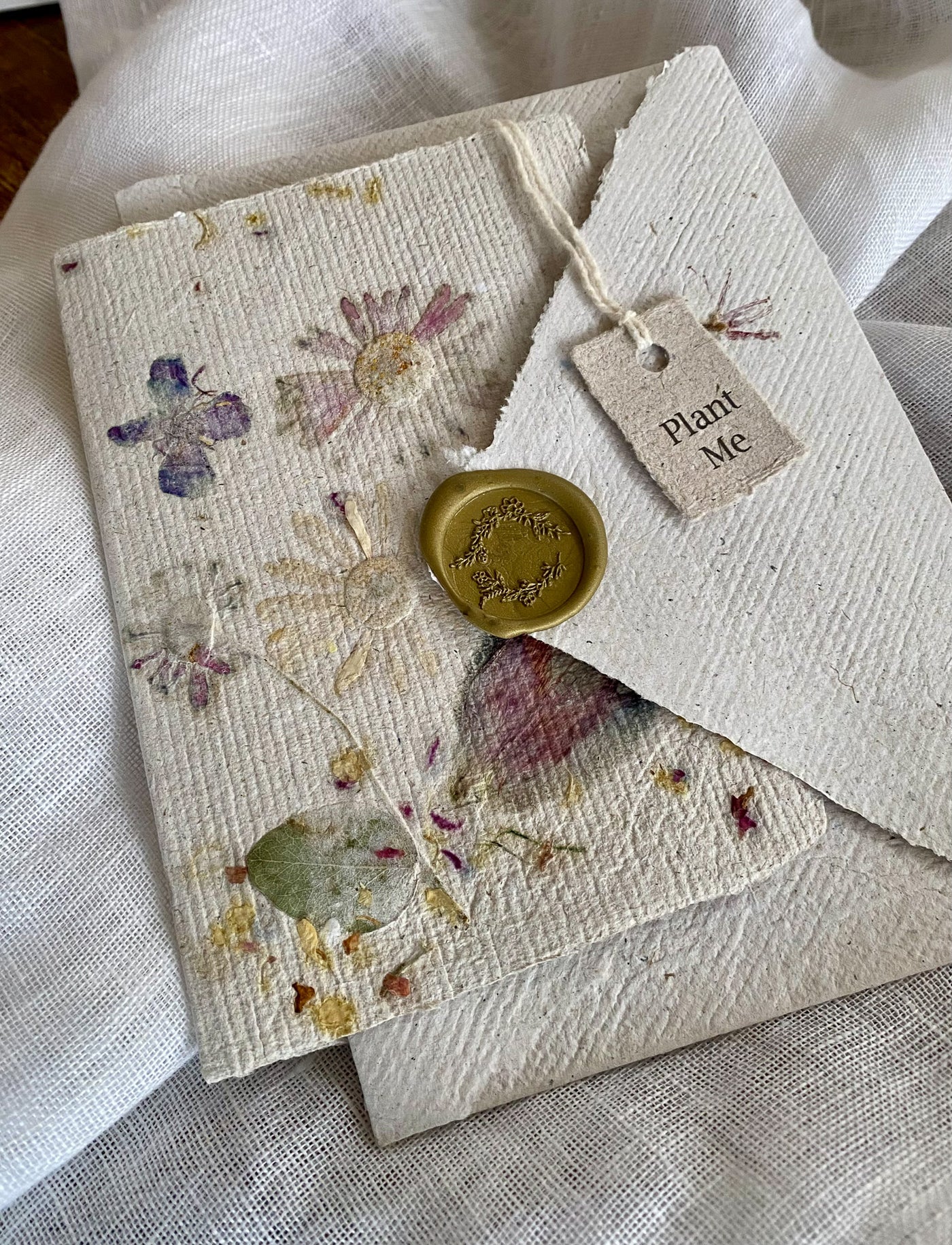 Handmade paper card with petal and leaf design Seed-embedded. Matching envelope with wax seal. Cards can be planted in the ground. Environmentally friendly and made in Australia