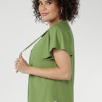 Naturally cool and silky on the skin, it features a relaxed silhouette with a flattering V-neckline and subtle pleat detailing for elevated comfort.