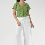 Crafted from breathable, soft bamboo jersey in limited quantities, the Bowie Top is an effortless, lightweight essential for work, weekends, and everyday comfort. Naturally cool and silky on the skin, it features a relaxed silhouette with a flattering V-neckline and subtle pleat detailing for elevated comfort.