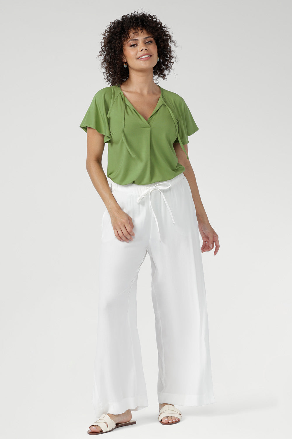 Crafted from breathable, soft bamboo jersey in limited quantities, the Bowie Top is an effortless, lightweight essential for work, weekends, and everyday comfort. Naturally cool and silky on the skin, it features a relaxed silhouette with a flattering V-neckline and subtle pleat detailing for elevated comfort.