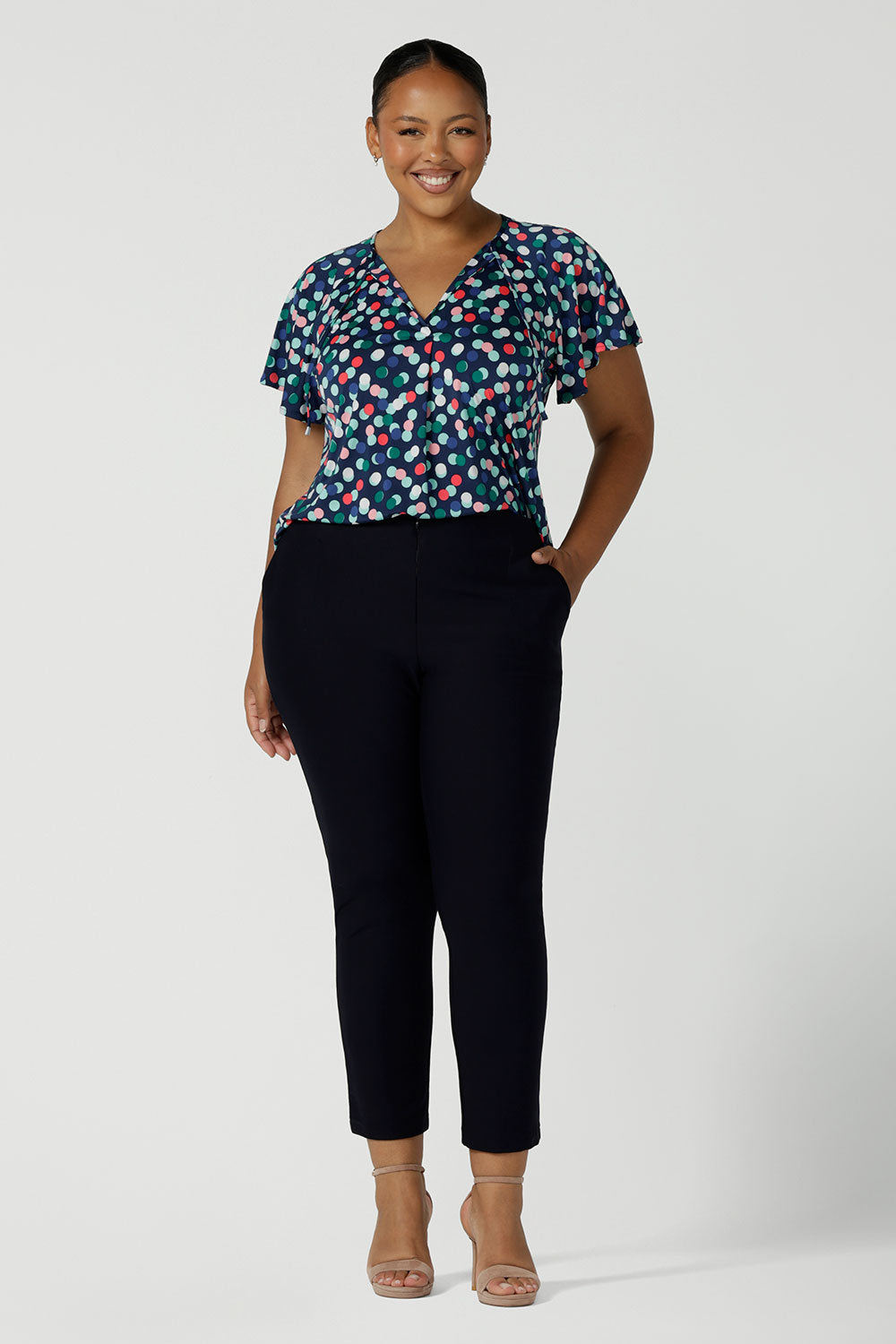 Curvy size 18 Woman wears Brooklyn pant in Navy. Slim leg trouser pant comfortable corporate wear. Australian made for women size 8 - 24.