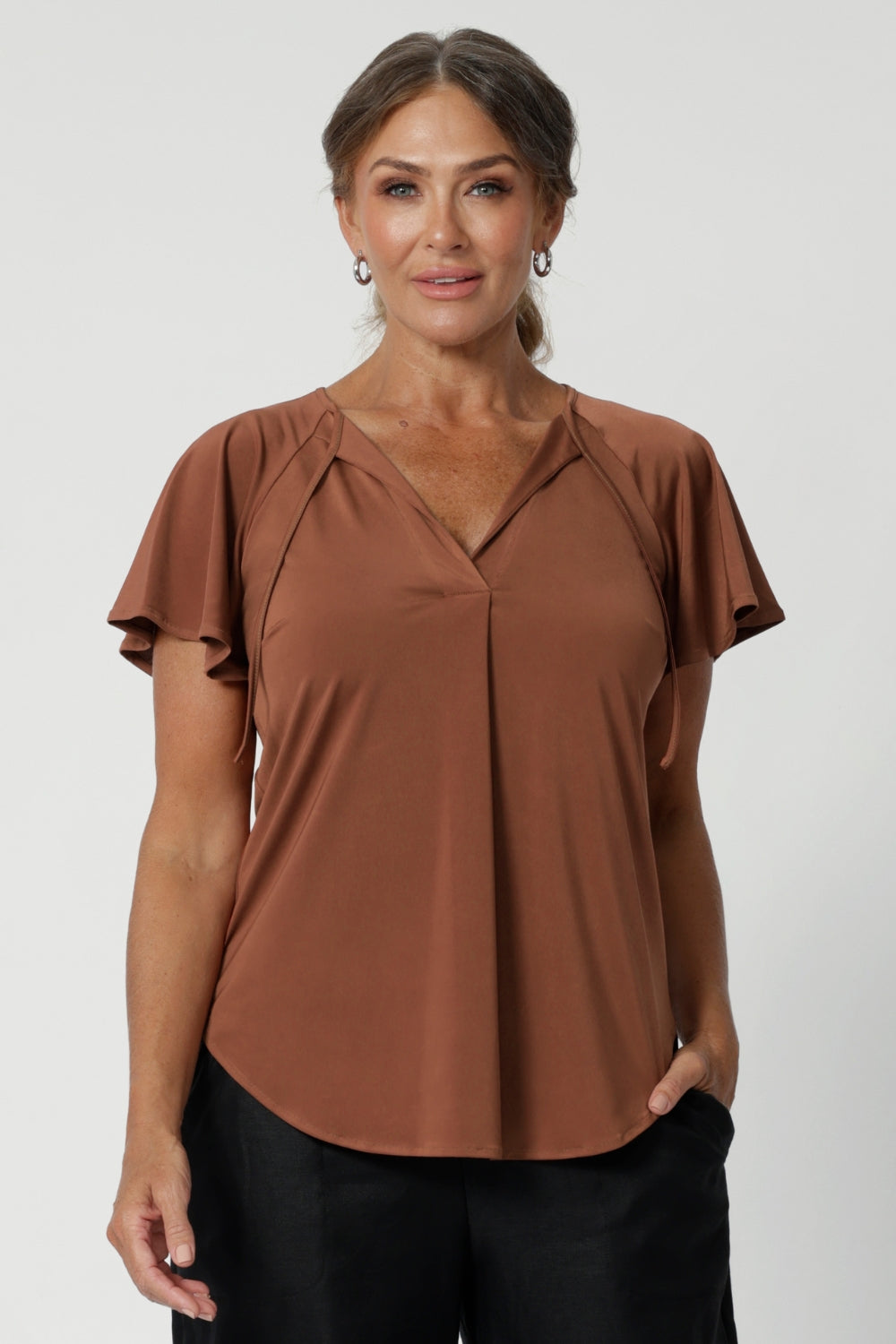 The Bowie Top is a must-have piece for any modern workwear wardrobe, offering effortless style and versatility. Its relaxed fit provides comfort while maintaining a polished, professional look. Available in sizes 8-24.