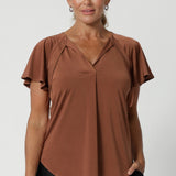 The Bowie Top is a must-have piece for any modern workwear wardrobe, offering effortless style and versatility. Its relaxed fit provides comfort while maintaining a polished, professional look. Available in sizes 8-24.