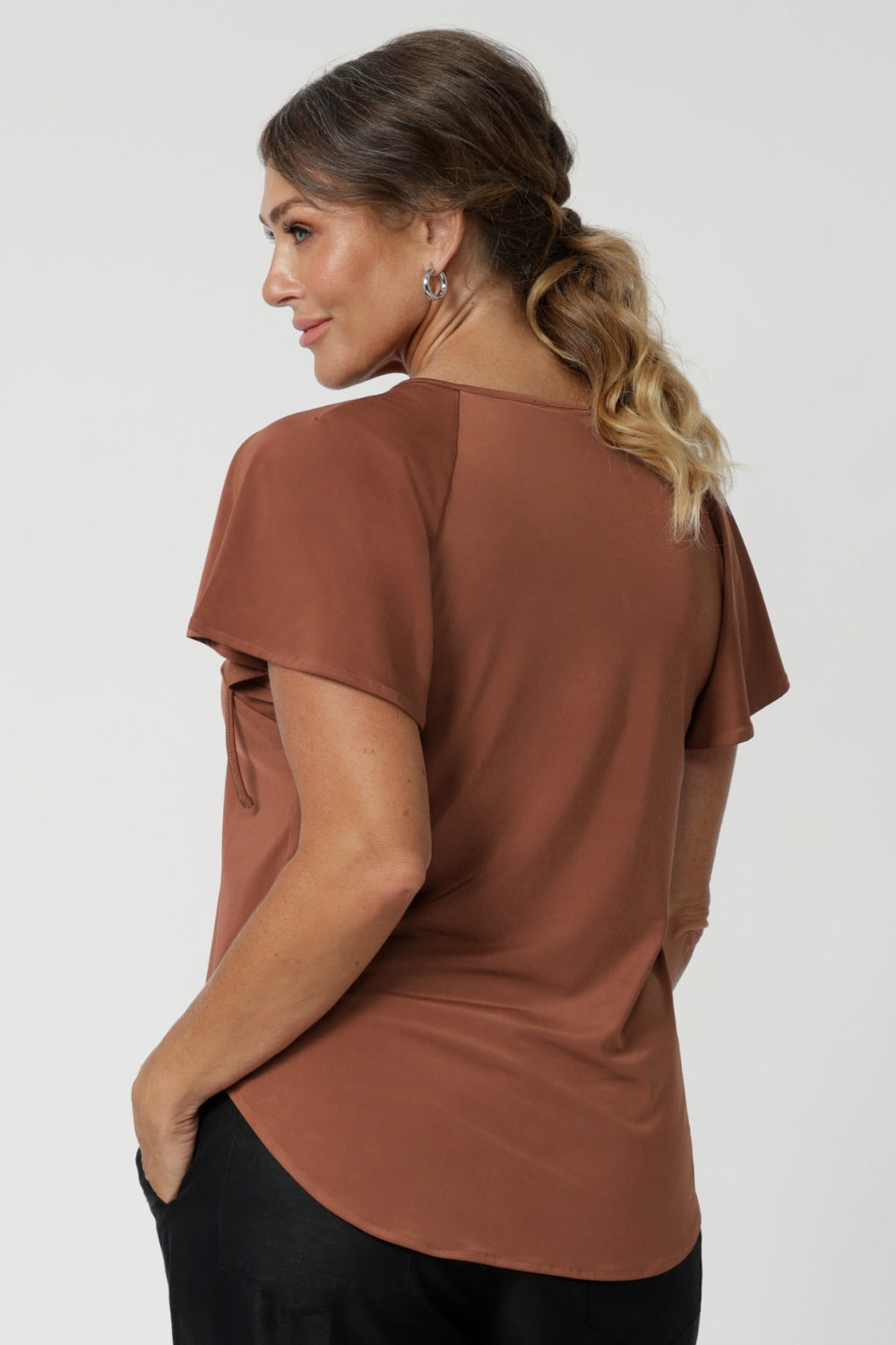 Available in sizes 8-24, the Bowie Top is Australian-made and comes in both plus-size and petite-friendly sizes, ensuring that every woman can enjoy its chic, flattering fit. In a tonal colour that pairs seamlessly with everything, this top is a versatile addition to any wardrobe, effortlessly transitioning between work and leisure.