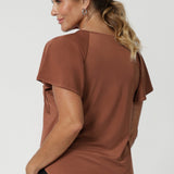 Available in sizes 8-24, the Bowie Top is Australian-made and comes in both plus-size and petite-friendly sizes, ensuring that every woman can enjoy its chic, flattering fit. In a tonal colour that pairs seamlessly with everything, this top is a versatile addition to any wardrobe, effortlessly transitioning between work and leisure.