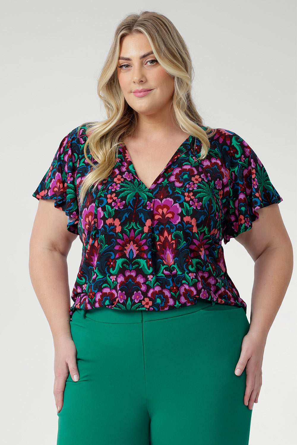 Designed with a relaxed fit, it features a flattering V-neckline and delicate fabric ties that can be worn loose or knotted for a vintage-inspired touch. 