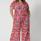 Styling option seen on a plus sized woman. Summer printed flutter sleeved top and matching printed pant to create faux jumpsuit look. Both pieces are stocked in sizes 8-24.