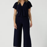 A size 10 woman wears the Bowie Top in Navy made in Australia for women size 8-24,