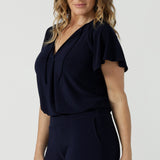 A size 10 woman wears the Bowie Top in Navy made in Australia for women size 8-24,