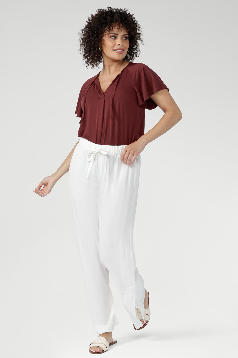 Cool, smooth, and naturally lightweight on the body, it features a relaxed silhouette with a flattering V-neckline and subtle pleat detailing.