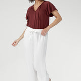 Cool, smooth, and naturally lightweight on the body, it features a relaxed silhouette with a flattering V-neckline and subtle pleat detailing.