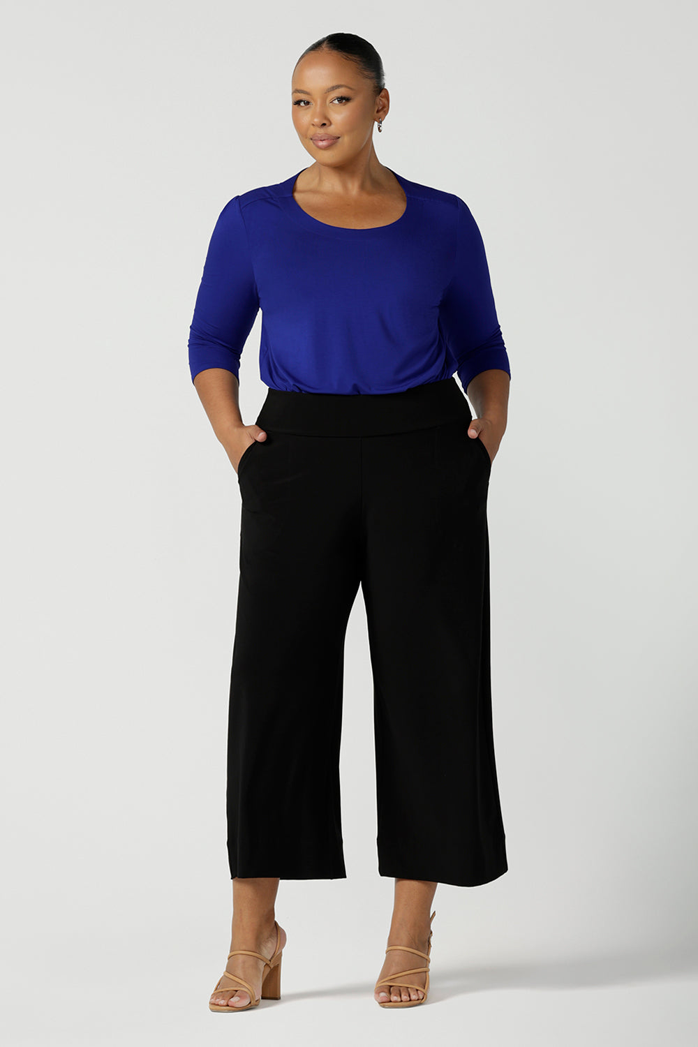 Comfortable, wide leg black culotte pants worn with a 3/4 sleeve, round neck top in cobalt blue bamboo jersey are worn by a plus size, size 18 woman - shop online at Australian women's clothing brand, Leina & Fleur.