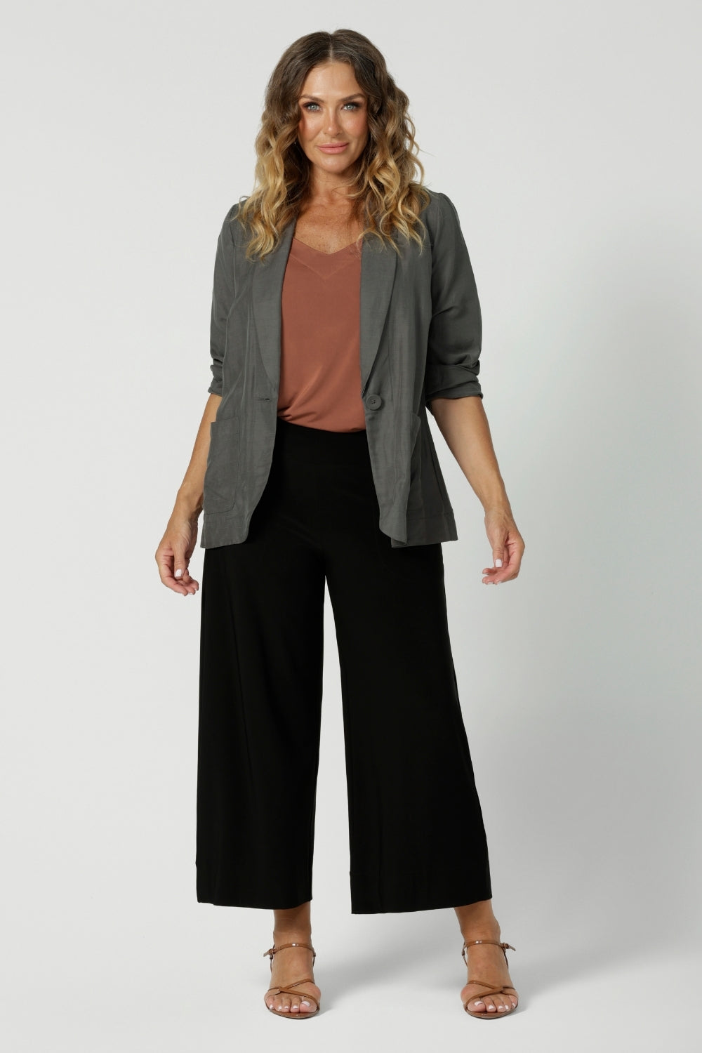 Wide leg black culotte pants worn with a clay coloured summer cami and light weight blazer made from dry touch jersey. Worn by size 12 woman - shop online at Australian women's clothing brand Leina & Fleur in sizes 8-24, with regular & short lengths available.