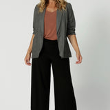 Wide leg black culotte pants worn with a clay coloured summer cami and light weight blazer made from dry touch jersey. Worn by size 12 woman - shop online at Australian women's clothing brand Leina & Fleur in sizes 8-24, with regular & short lengths available.