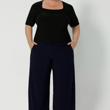 Australian made clothing brand Leina & Fleur have crafted the perfect back to work pant. Plus size woman wears navy wide leg culottes that are now offered in both short & regular lengths. Available in sizes 8-24.