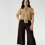 Petite Height woman wears a pair of Bradley Culotte Pants for a comfortable soft suiting combination. Available in sizes 8-24 and in 2 lengths.